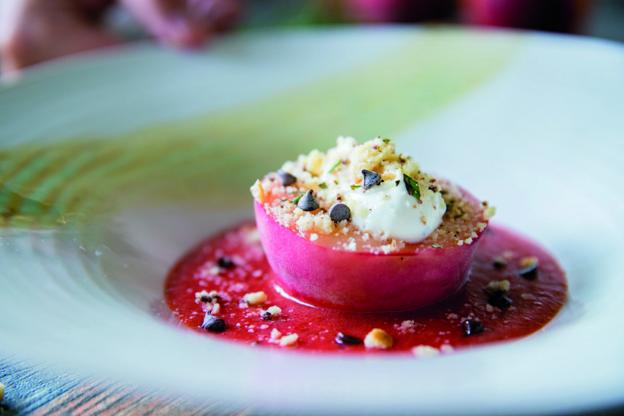 Peach dessert with strawberries and rosemary