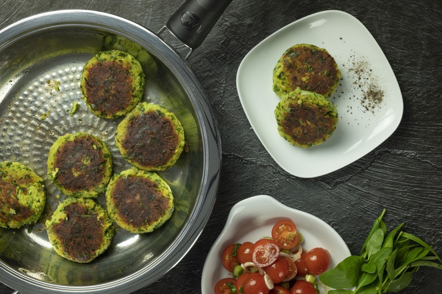 Potato burger with tomato salad
