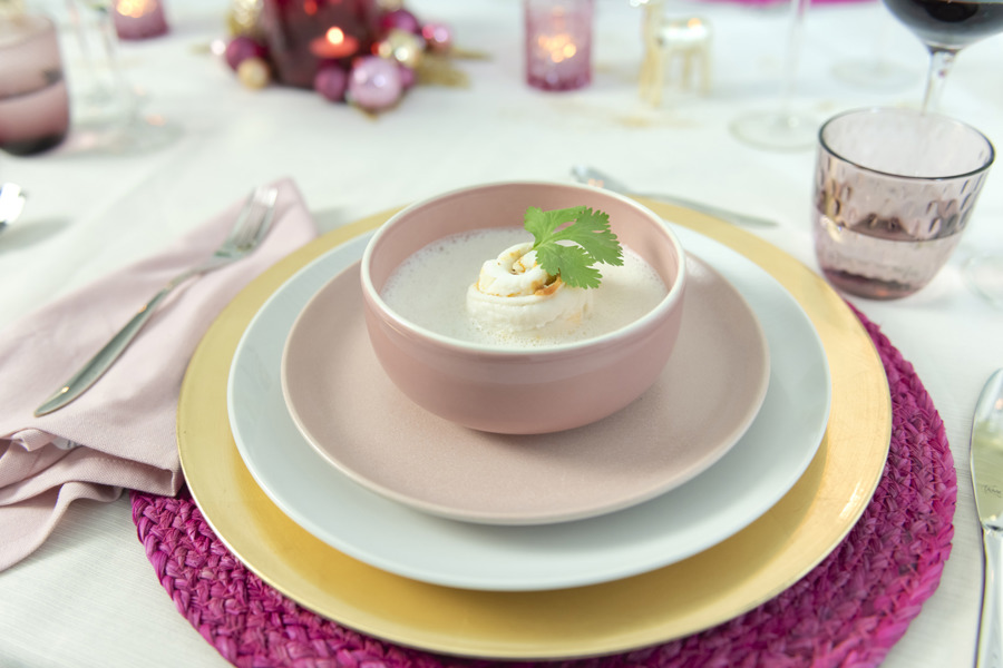Foamy coconut soup with fish rolls