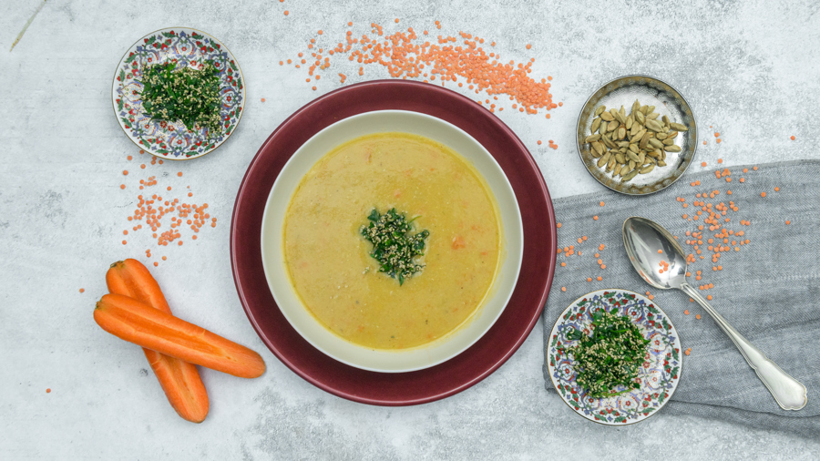 Lentil soup with sesame and herb topping