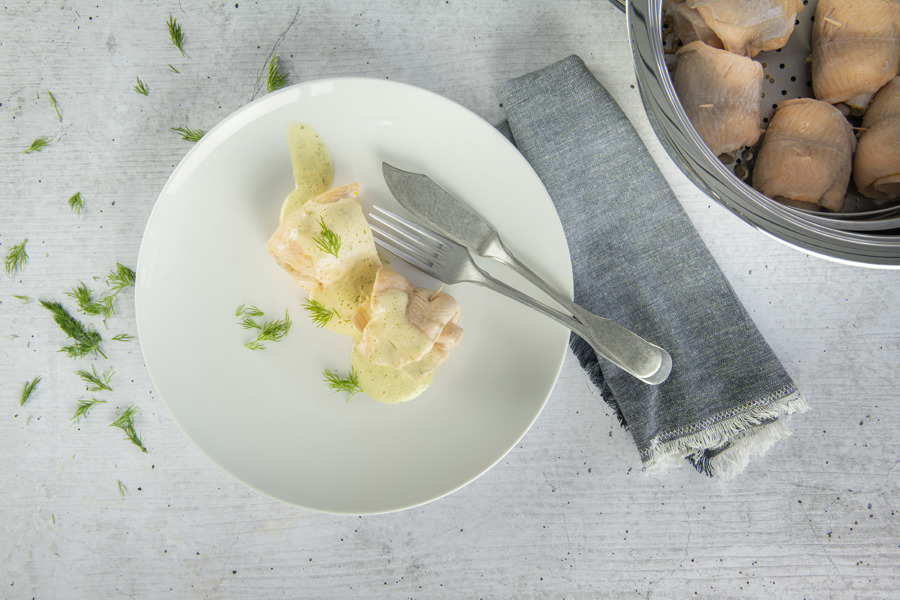 Mini rolls of char served on cucumber and dill foam