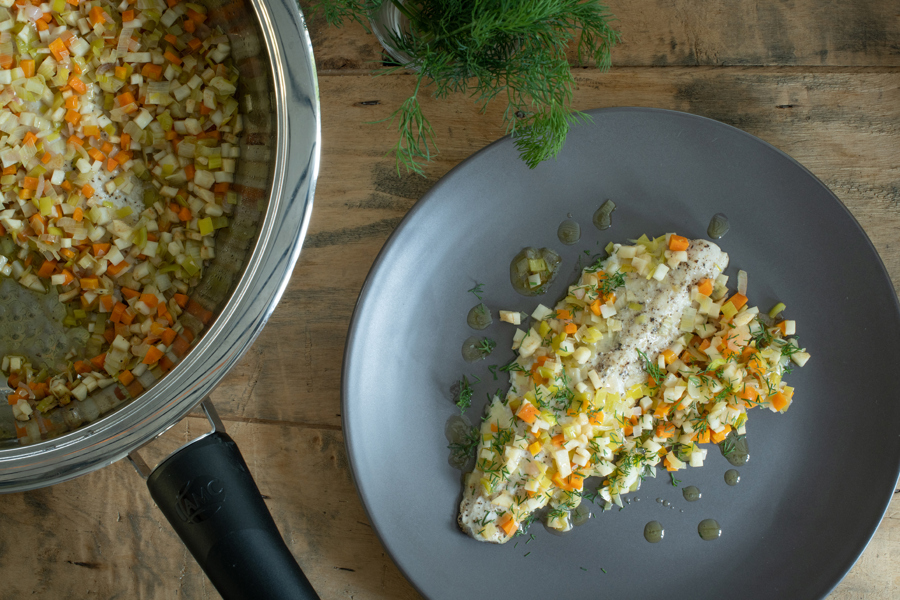 Char fillet on a vegetable vinaigrette